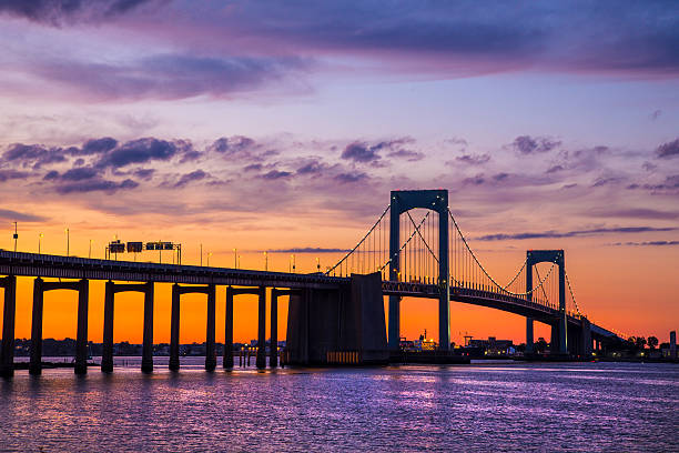 Colorful sunset over Long Island Sound and Throgs Neck Bridge in New York City